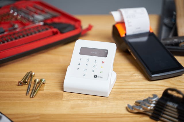 debit machine and tools on table