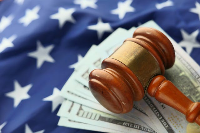 gavel on pile of cash