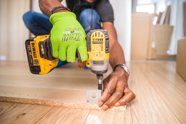 person using a power drill