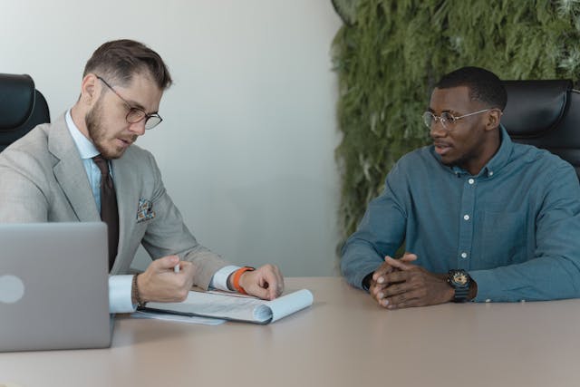 two people reviewing forms